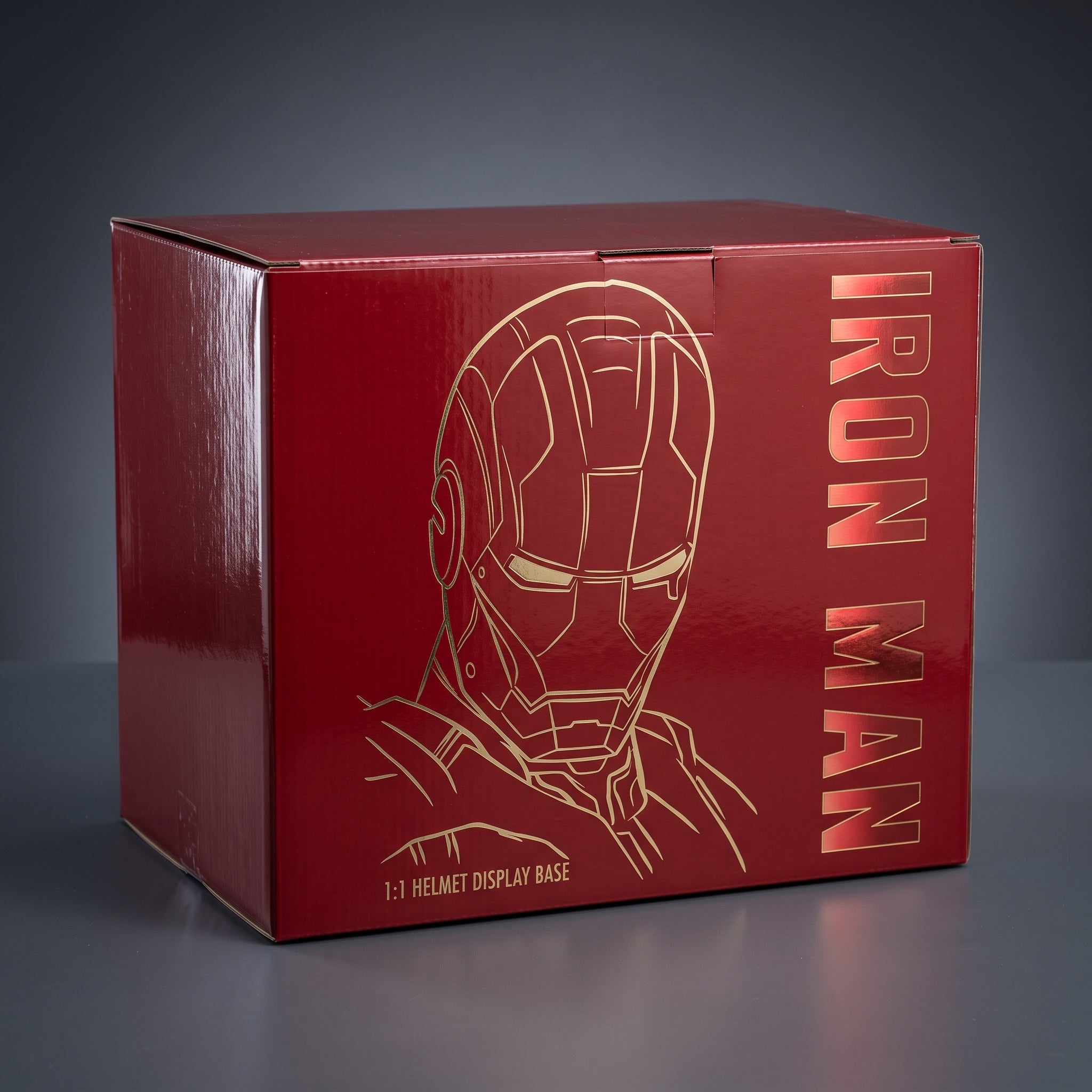 Iron Man helmet display stand retail box, closed, showing the printed artwork