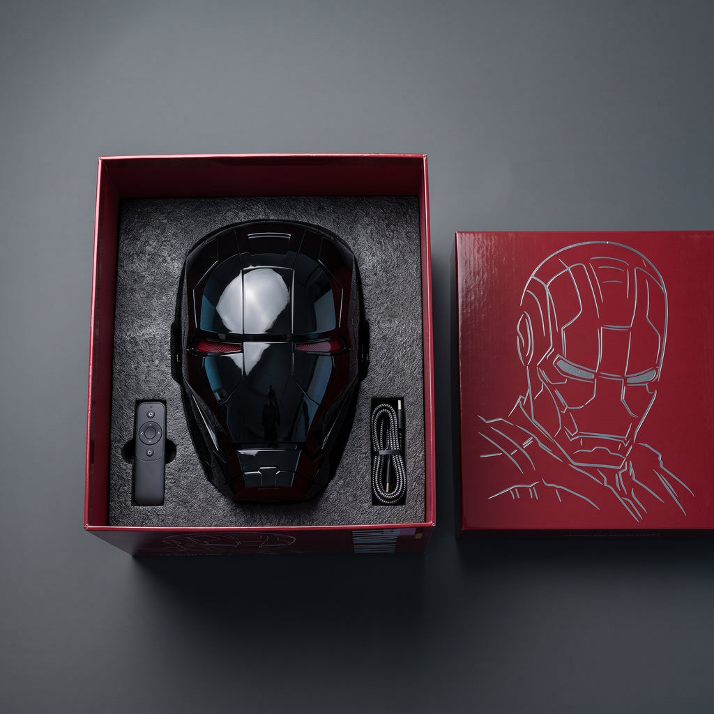 Gloss black Mark V helmet in its open box with remote control and USB charging cable