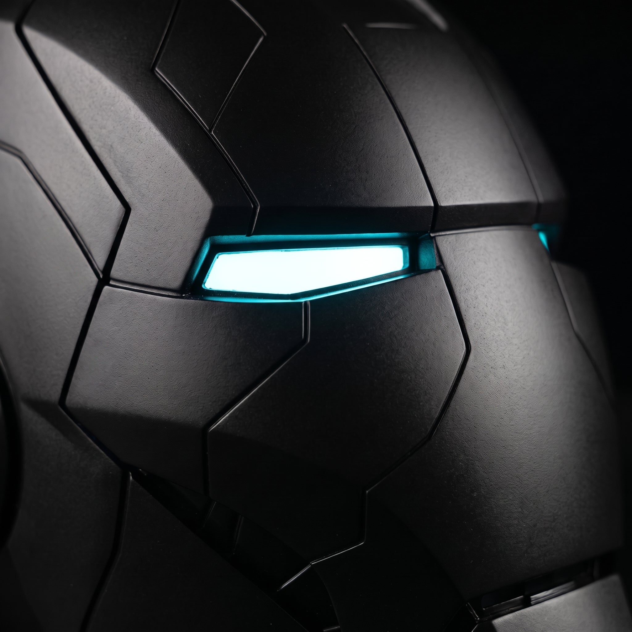 Close-up of the matte black Mark V helmet showing panel seams and illuminated LED eye slits