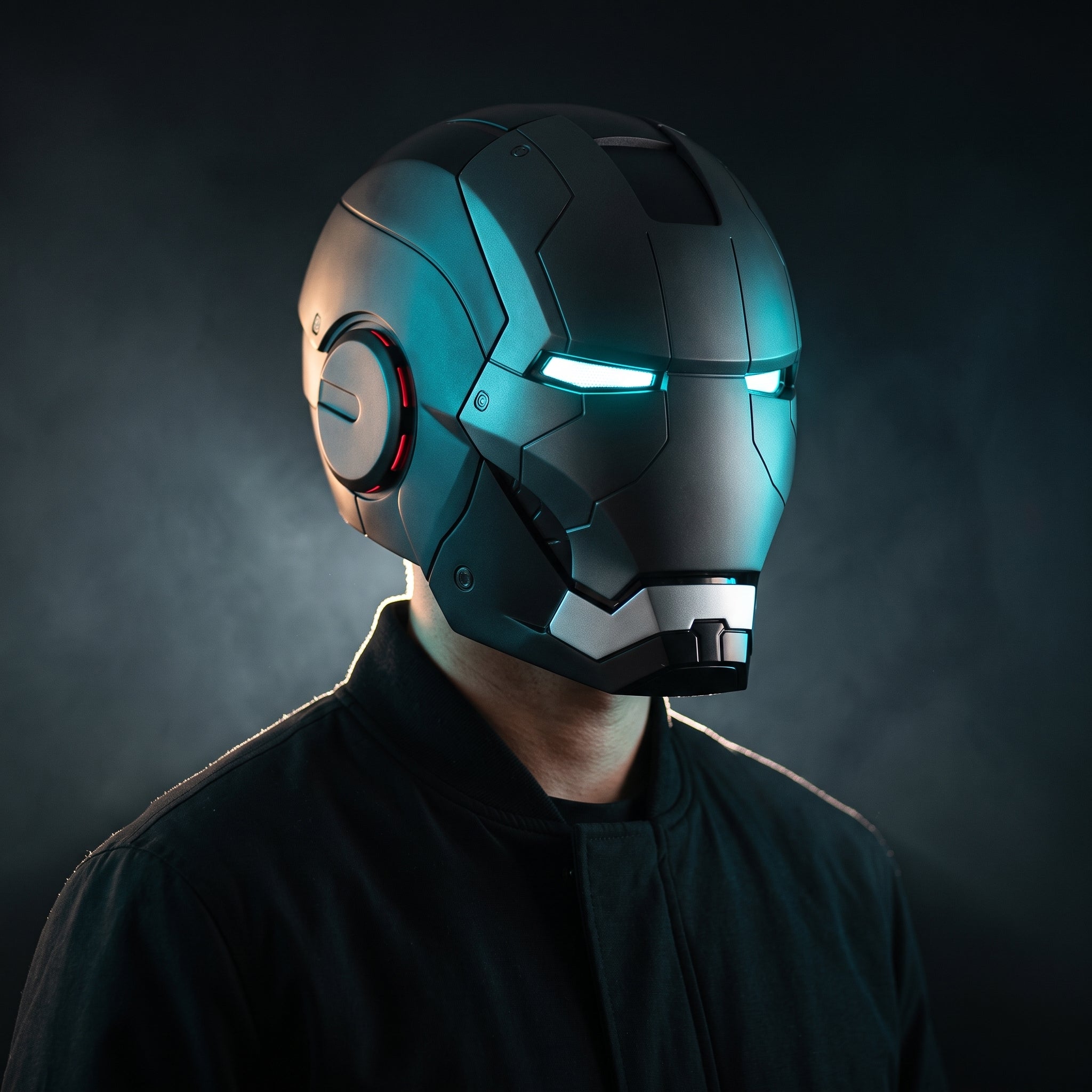 Adult wearing the matte black Mark V Iron Man helmet with the LED eyes lit
