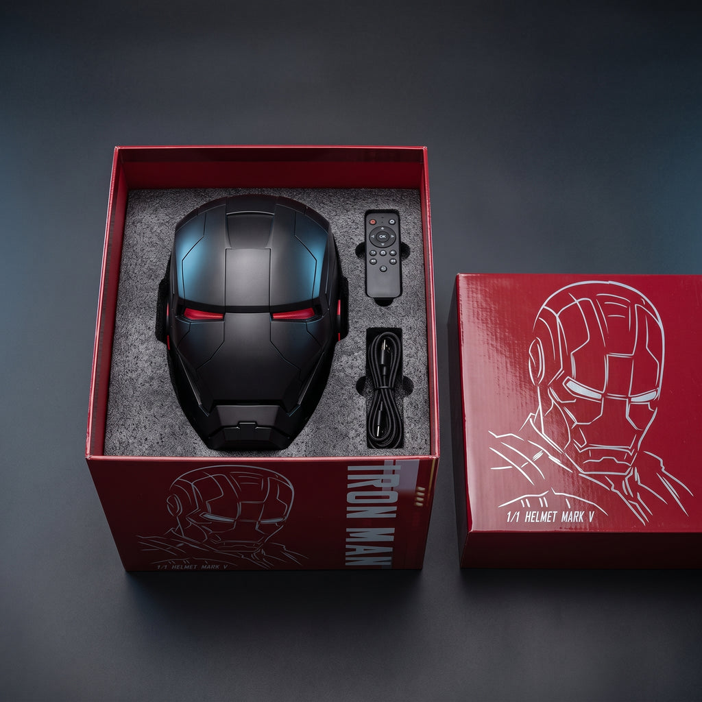 Matte black Mark V helmet in its open box with remote control and USB charging cable