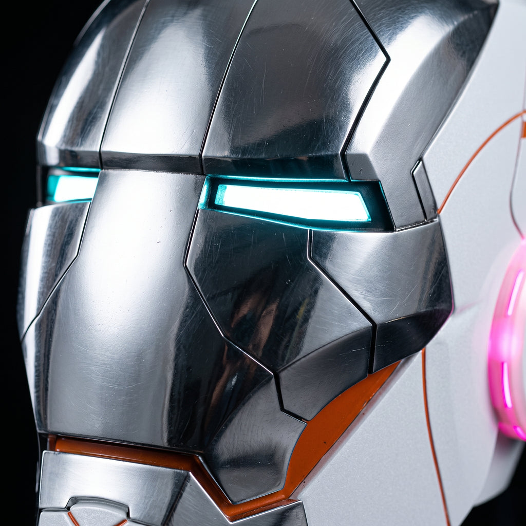 Close-up of the white and silver Mark V helmet showing panel seams and illuminated LED eye slits