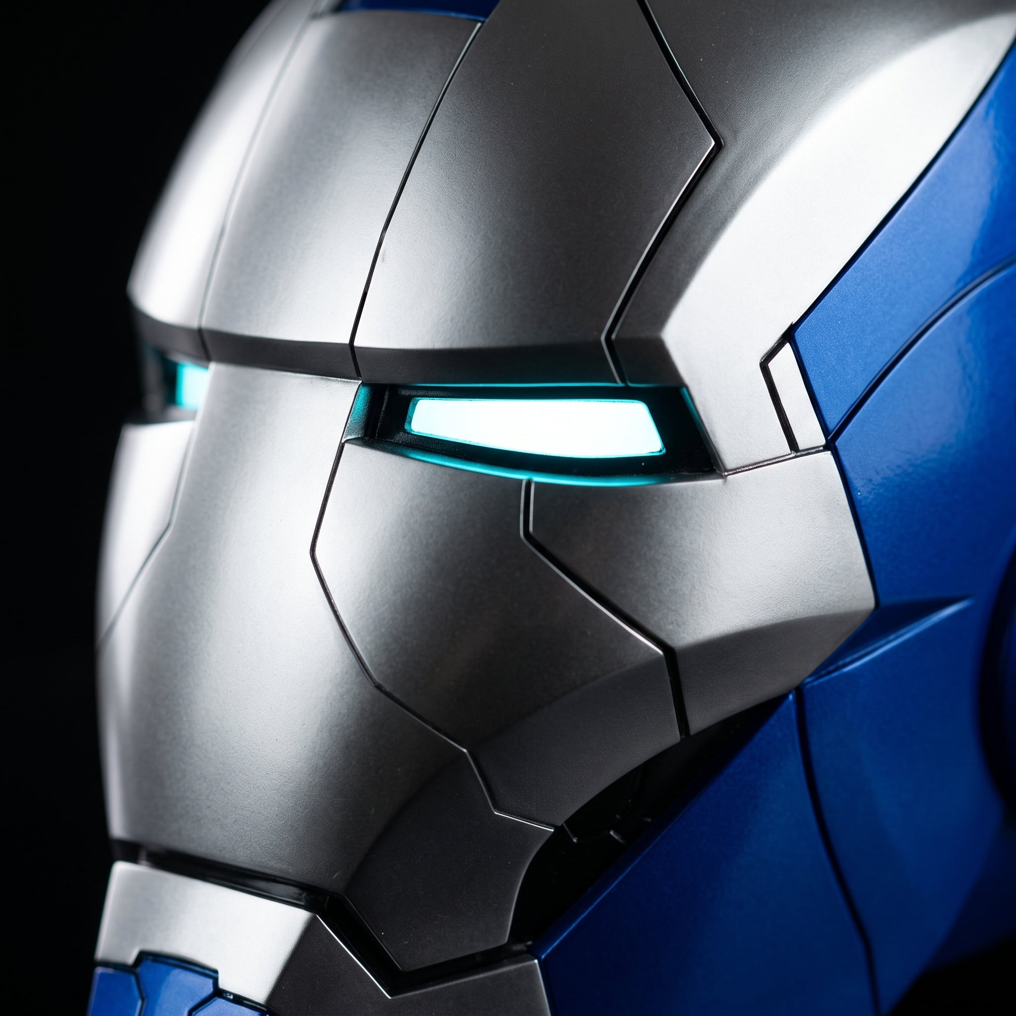 Close-up of the blue and silver Mark V helmet showing panel seams and illuminated LED eye slits