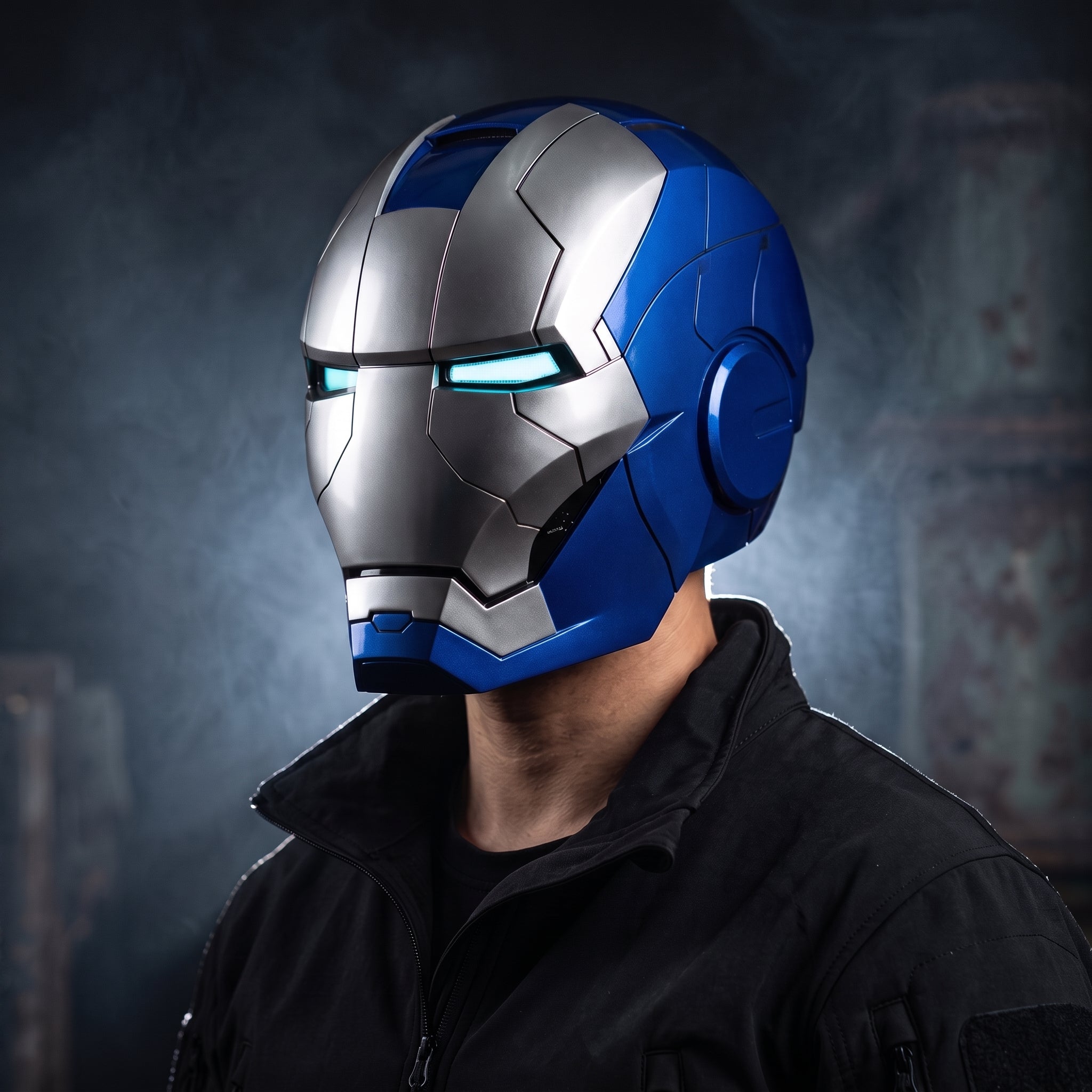 Adult wearing the blue and silver Mark V Iron Man helmet with the LED eyes lit