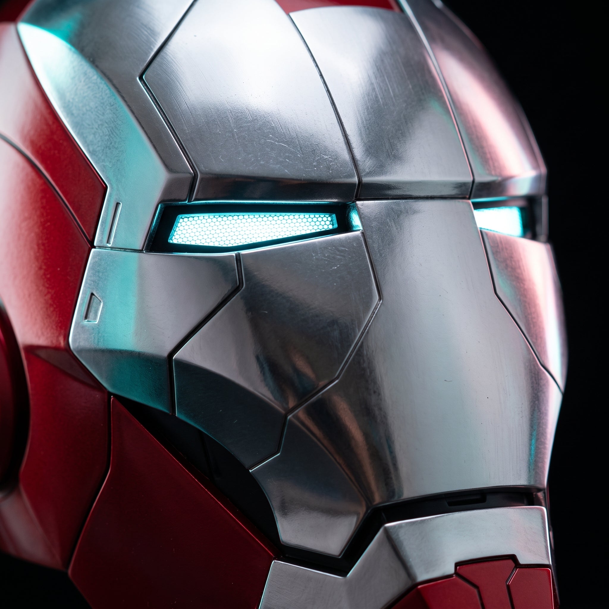 Close-up of the silver and red Mark V helmet showing panel seams and illuminated LED eye slits