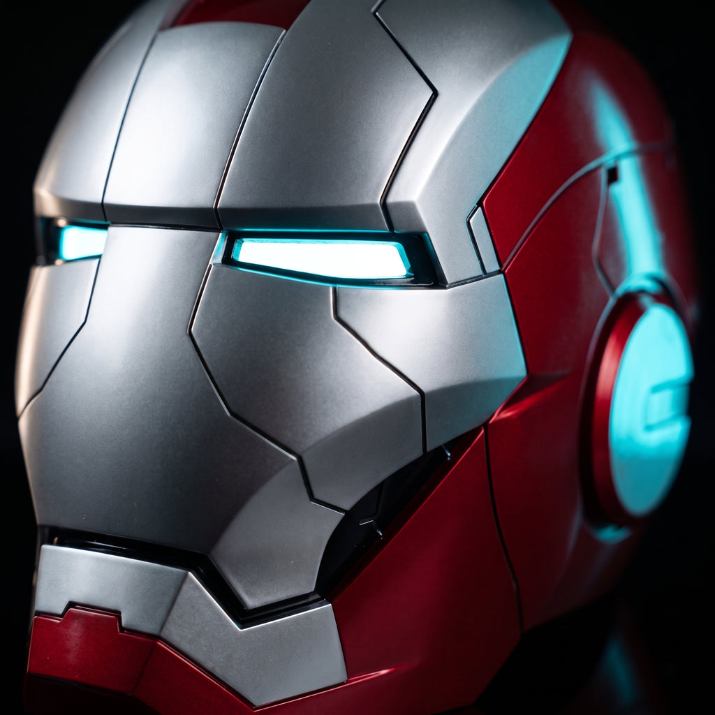Close-up of the matte silver and red Mark V helmet showing seams and lit LED eye slits