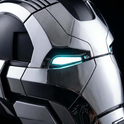 Close-up of the chrome and black Mark XVII helmet showing seams and lit LED eye slits