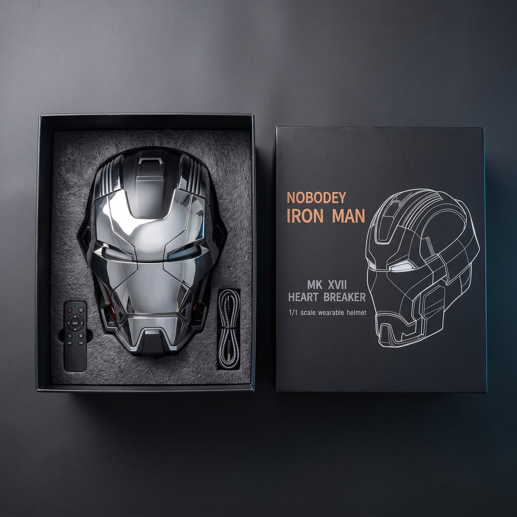 Chrome and black Mark XVII helmet in its open box with remote and USB charging cable